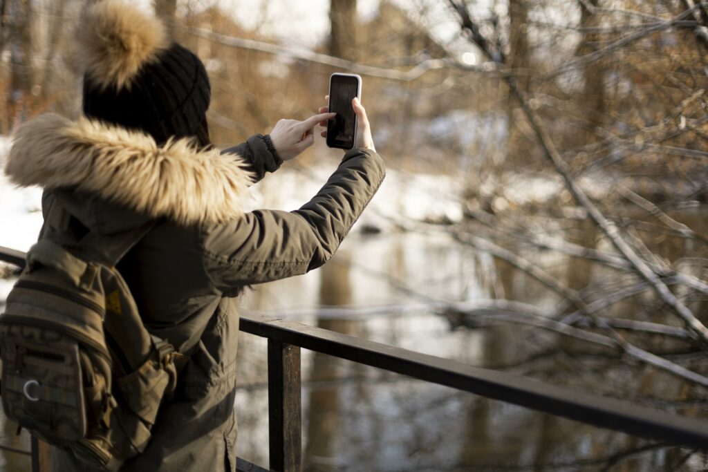 medium shot traveler taking photos x