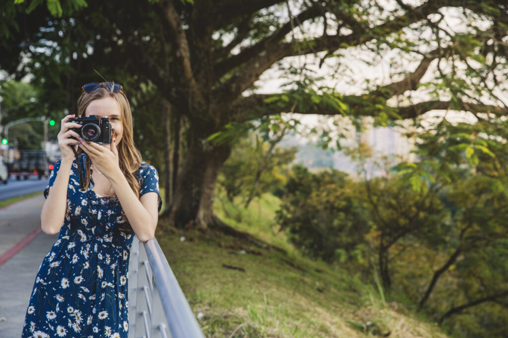 young girl taking photo x