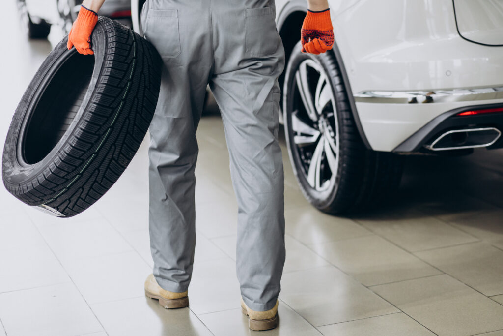 mechanic changing tires car service  x