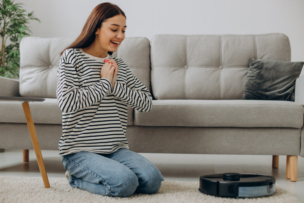 woman relaxing while robot vacuum cleaner cleaning up room x